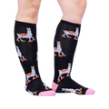 Lifestyle shot showing the socks on a person's legs, showcasing how they look when worn.