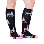 Lifestyle shot showing the socks on a person's legs, showcasing how they look when worn.