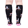 Rear view of the socks on a person's legs, highlighting the full pattern.