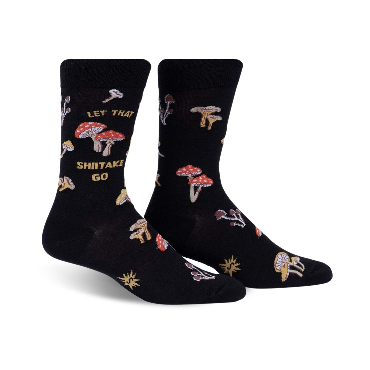 Pair of black crew socks featuring a whimsical mushroom design and the phrase 'Let That Shiitake Go'.  Red and gold mushroom illustrations scattered across the socks.