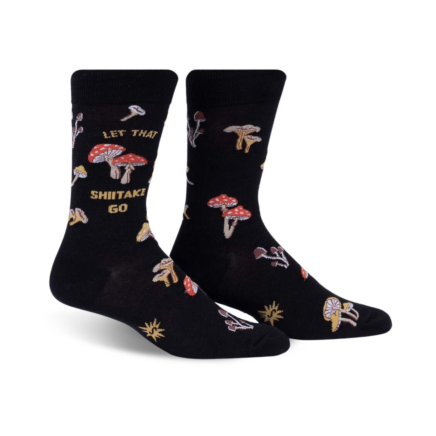 Pair of black crew socks featuring a whimsical mushroom design and the phrase 'Let That Shiitake Go'.  Red and gold mushroom illustrations scattered across the socks.