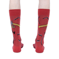 Rear view of the 'Nailed It' socks on a person, emphasizing the full design.