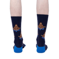 Back view of the Meditating Bigfoot socks worn on a person's legs. Shows the full design on each sock.