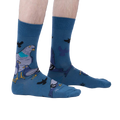 Lifestyle shot of a person wearing the So Fly So Coo socks, showcasing the fit and style on the foot and leg.