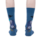Rear view of the So Fly So Coo socks on a person's legs, highlighting the design on the back of the socks.