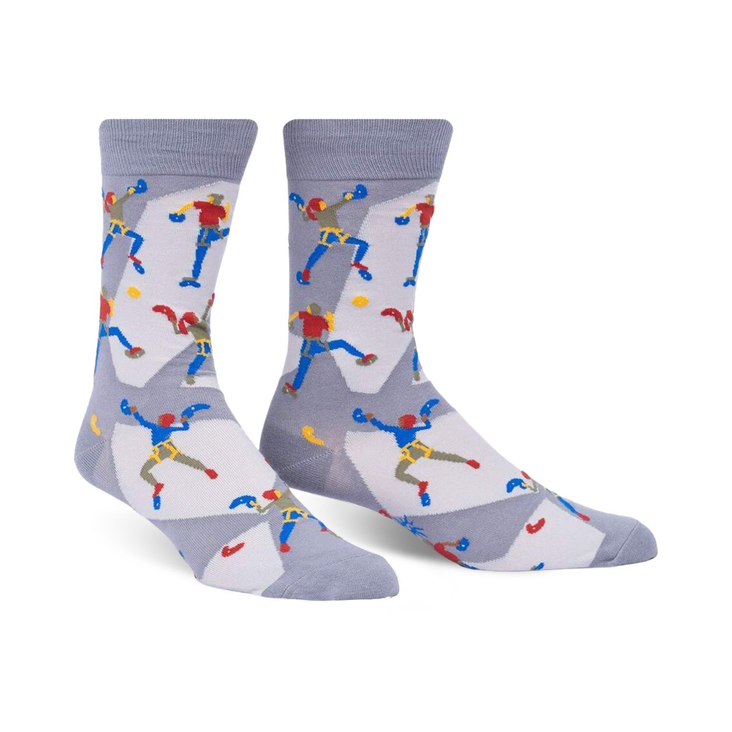 A pair of gray crew socks with a repeating pattern of illustrated rock climbers in red, blue, and yellow. 