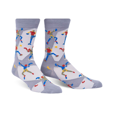 sock climbing fun pattern mens crew socks. colorful mountain climbers on white background.    