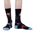 Lifestyle shot: A person modeling the Thoracic Park socks, showing how they look when worn.