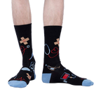 Lifestyle shot: A person modeling the Thoracic Park socks, showing how they look when worn.