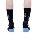 Back view of the Thoracic Park socks on a model's legs, highlighting the design details on the back of the socks.