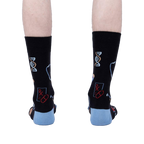 Back view of the Thoracic Park socks on a model's legs, highlighting the design details on the back of the socks.
