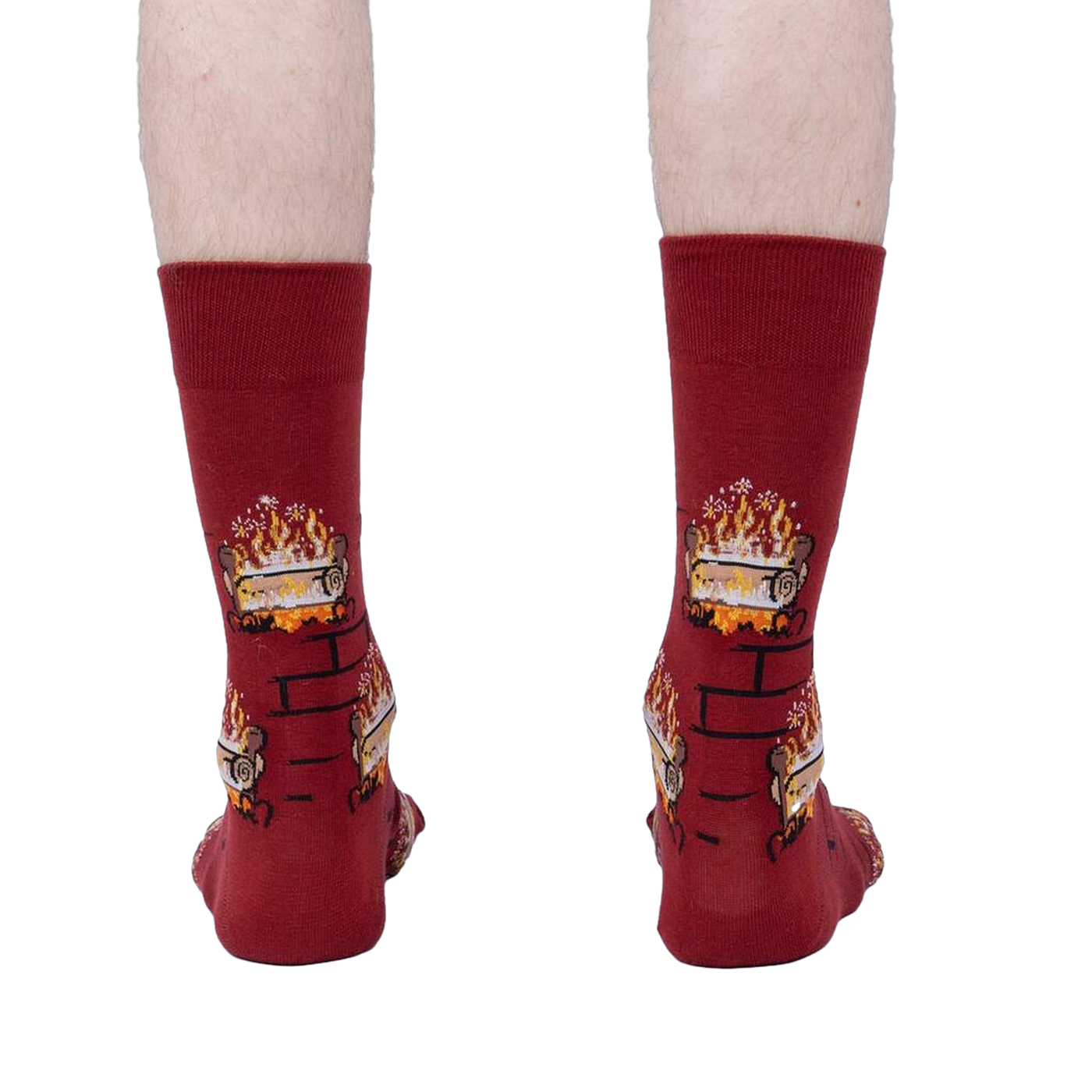 Rear view of a person wearing the Yule Log socks, showcasing the full design on the back of the socks.