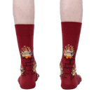 Rear view of a person wearing the Yule Log socks, showcasing the full design on the back of the socks.