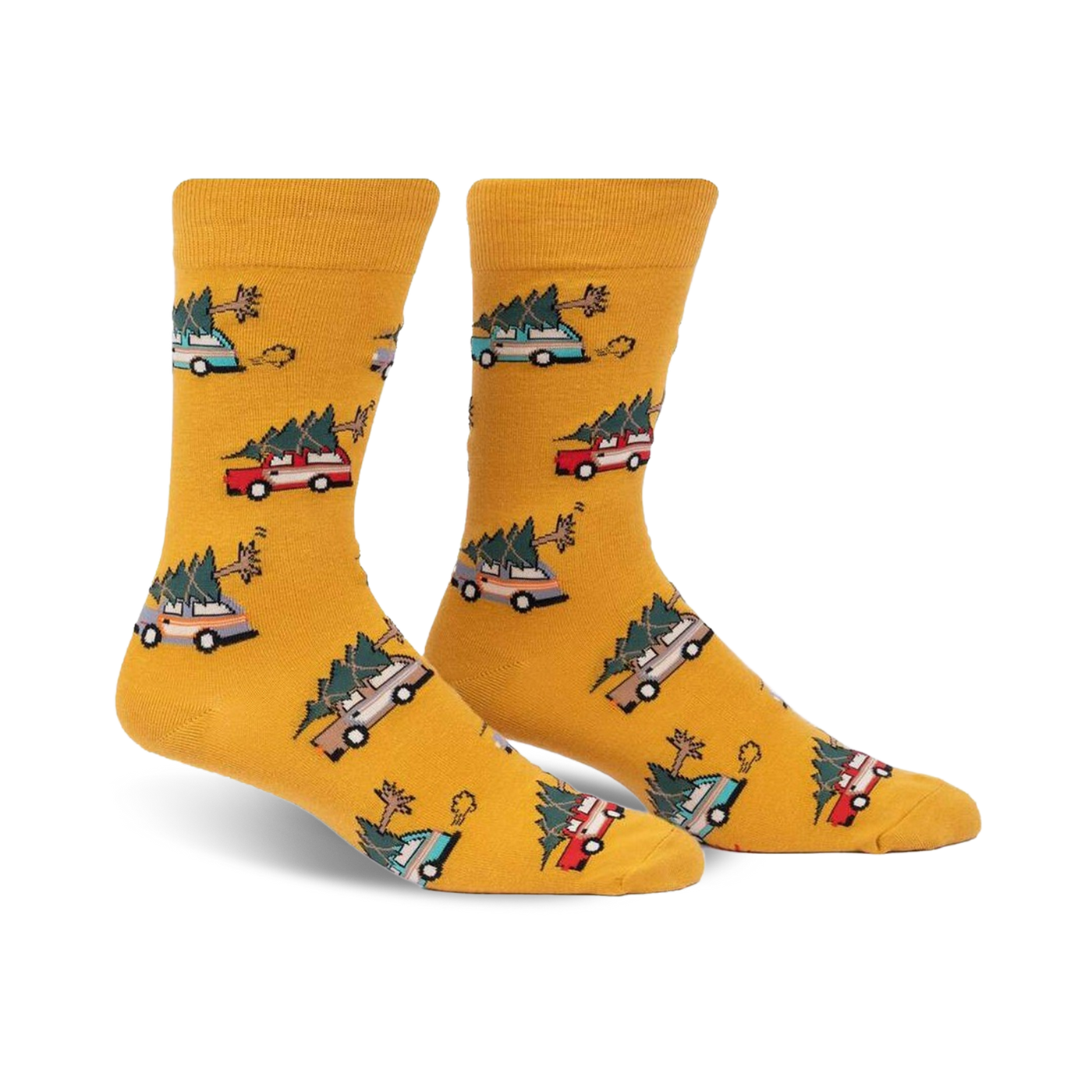 Pair of mustard yellow crew socks with a repeating pattern of cartoon cars carrying Christmas trees. 