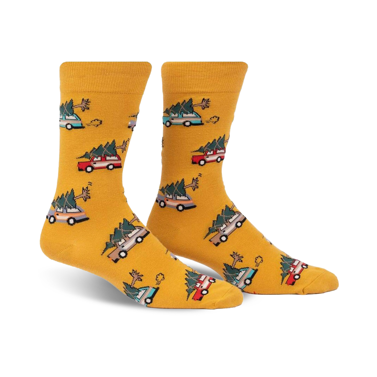 Pair of mustard yellow crew socks with a repeating pattern of cartoon cars carrying Christmas trees. 