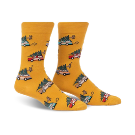 yellow crew socks with festive pattern of green, red, and blue christmas trees and brown cars carrying them. for men.   
