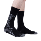 Lifestyle shot: A model wearing the black 'Music Is My Forte' socks, showcasing the design and fit.