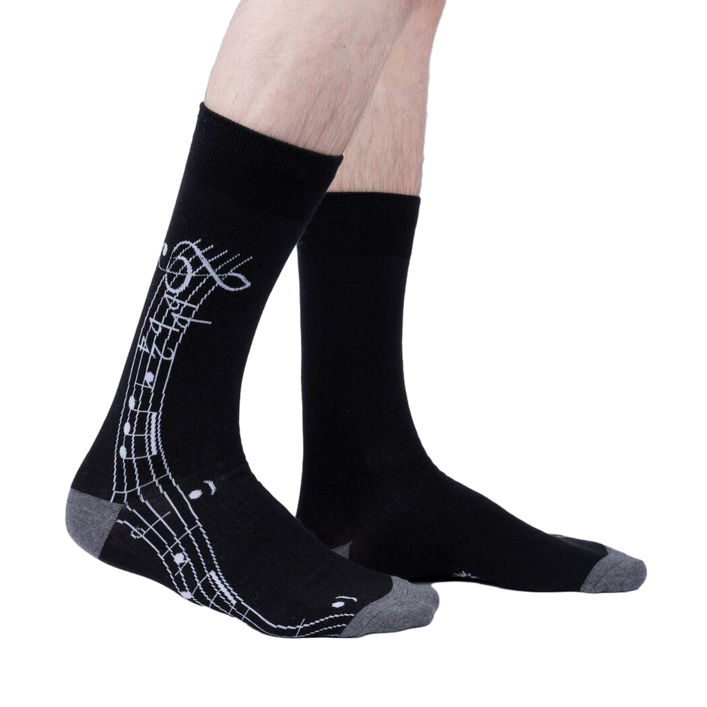 Lifestyle shot: A model wearing the black 'Music Is My Forte' socks, showcasing the design and fit.