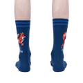 Rear view of a person wearing a pair of navy blue 'Zero Fox Given' socks. The fox graphic and text are partially visible on each sock.