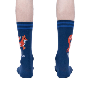 Rear view of a person wearing a pair of navy blue 'Zero Fox Given' socks. The fox graphic and text are partially visible on each sock.