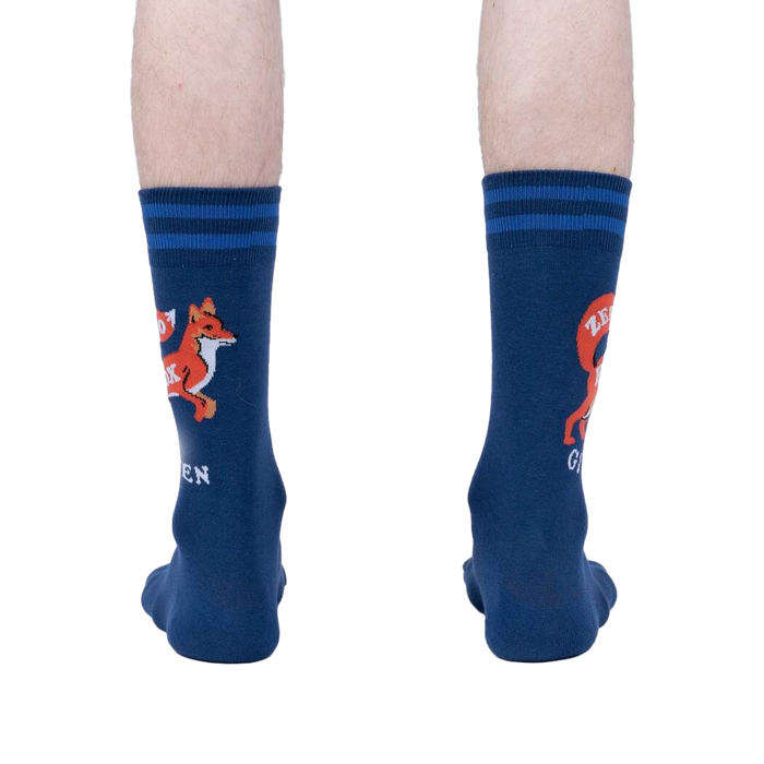 Rear view of a person wearing a pair of navy blue 'Zero Fox Given' socks. The fox graphic and text are partially visible on each sock.
