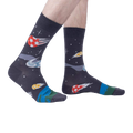Lifestyle shot showing 'Lets Kick It' socks on a person's feet, highlighting the fit and overall look.
