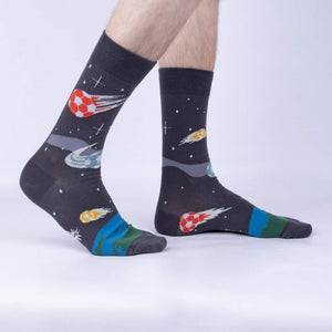 A pair of gray socks with a soccer ball pattern.
