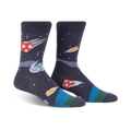 Pair of dark grey crew socks with a fun design of soccer balls streaking across space like comets. Features orange, yellow, and blue accents.