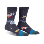 Pair of dark grey crew socks with a fun design of soccer balls streaking across space like comets. Features orange, yellow, and blue accents.