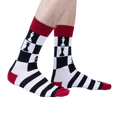 Lifestyle shot showing 'Check Yeah' socks on a person's legs against a white background.