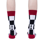 Rear view of model wearing 'Check Yeah' socks, showcasing the back design and color details.