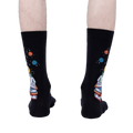 Rear view of the socks on a person's legs, highlighting the design on the back of the socks.