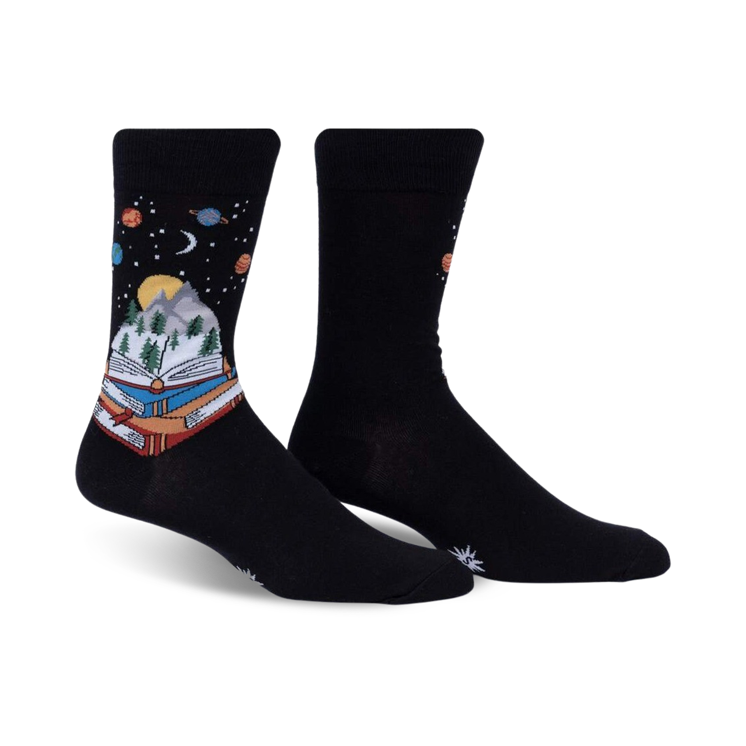 Pair of black crew socks featuring a whimsical design of a book with a mountain landscape inside, set against a starry night sky with planets.