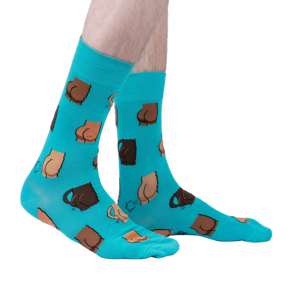 A lifestyle shot showing the teal 'Kiss My' socks on a person's feet.