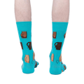 Back view of a pair of teal 'Kiss My' socks on a person's legs.