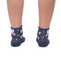 Rear view of a person's legs wearing the Sitting Kitty Turn Cuff socks, showcasing the rolled-down cuff design.