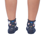 Rear view of a person's legs wearing the Sitting Kitty Turn Cuff socks, showcasing the rolled-down cuff design.