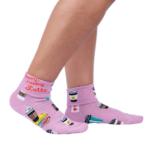 Lifestyle shot: Woman's legs wearing the 'Sorry Running Latte' socks, showing the design and fit.