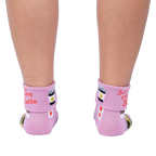 Back view of the socks on a person's legs, showcasing the rolled-down cuff message.