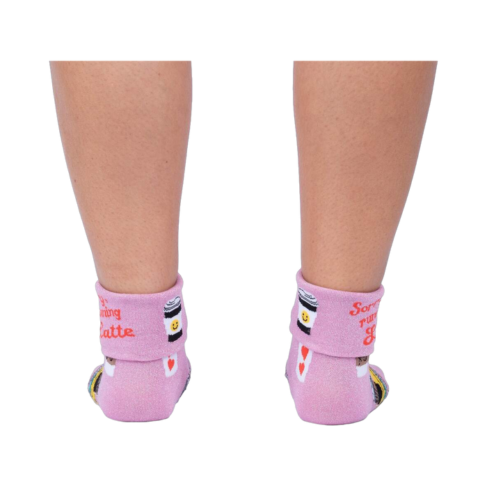 Back view of the socks on a person's legs, showcasing the rolled-down cuff message.