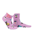 Another lifestyle shot of the socks, highlighting the pink glitter fabric and coffee cup designs.