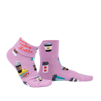 Another lifestyle shot of the socks, highlighting the pink glitter fabric and coffee cup designs.