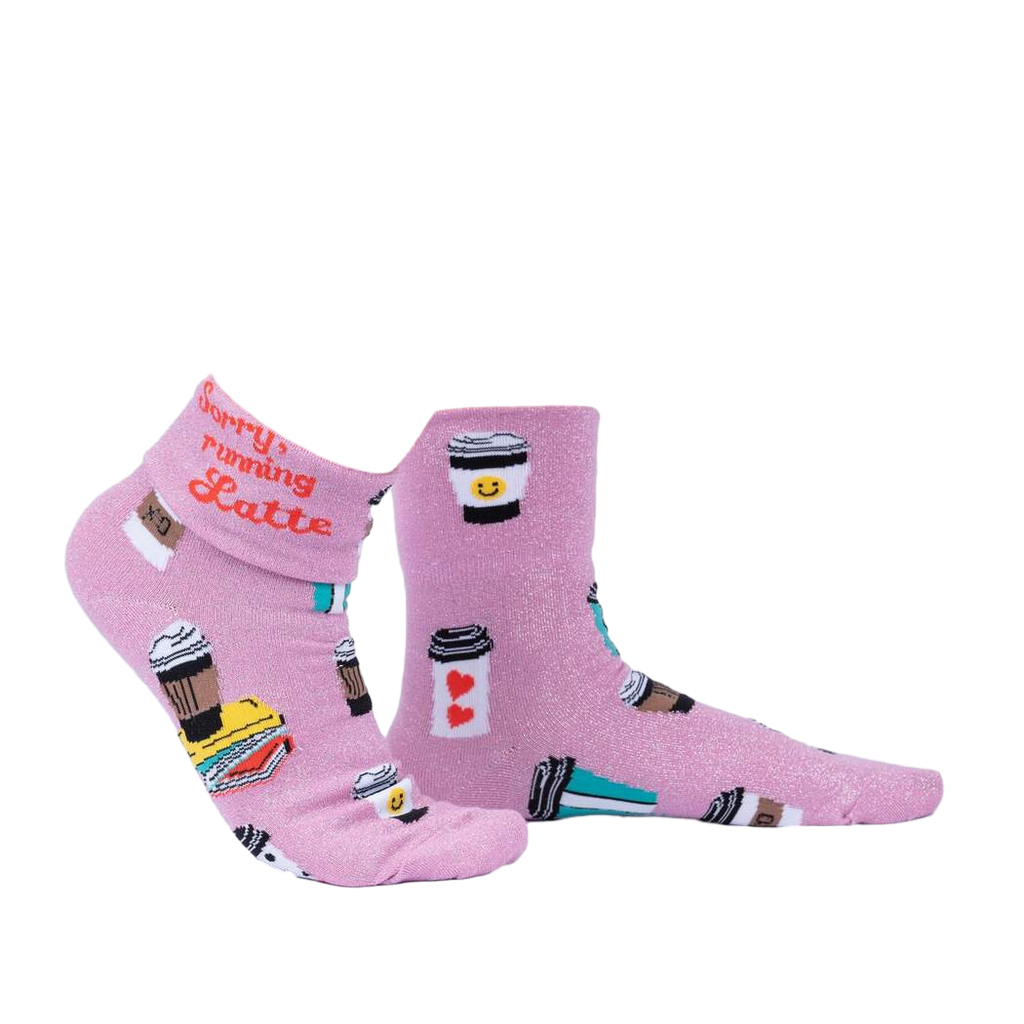 Another lifestyle shot of the socks, highlighting the pink glitter fabric and coffee cup designs.