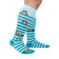 Lifestyle shot showcasing the 'My Otter Foot' knee-high socks on a model's legs, highlighting their fit and appearance.