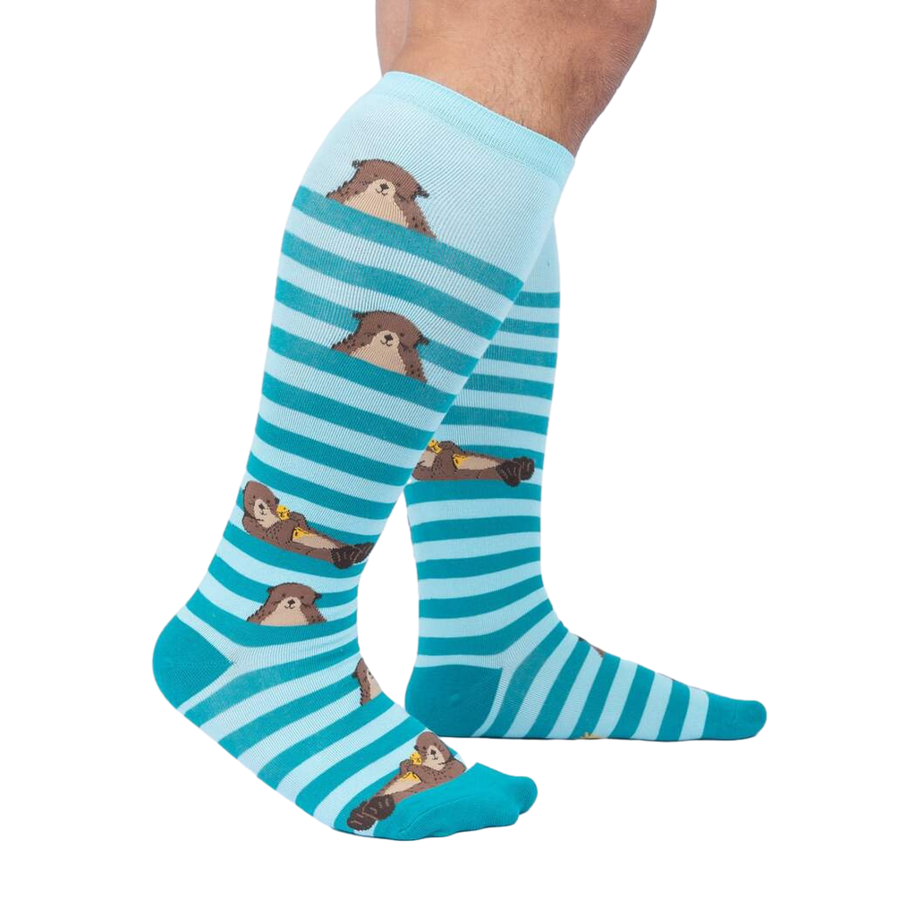 Lifestyle shot showcasing the 'My Otter Foot' knee-high socks on a model's legs, highlighting their fit and appearance.