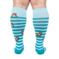 Back view of the 'My Otter Foot' socks on a model's legs, showing the full design and how the otters are positioned on the back of the leg.