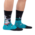 Lifestyle shot of a person wearing the 'Out of Boaty Experience' socks.