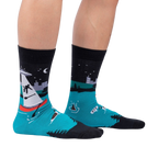 Lifestyle shot of a person wearing the 'Out of Boaty Experience' socks.
