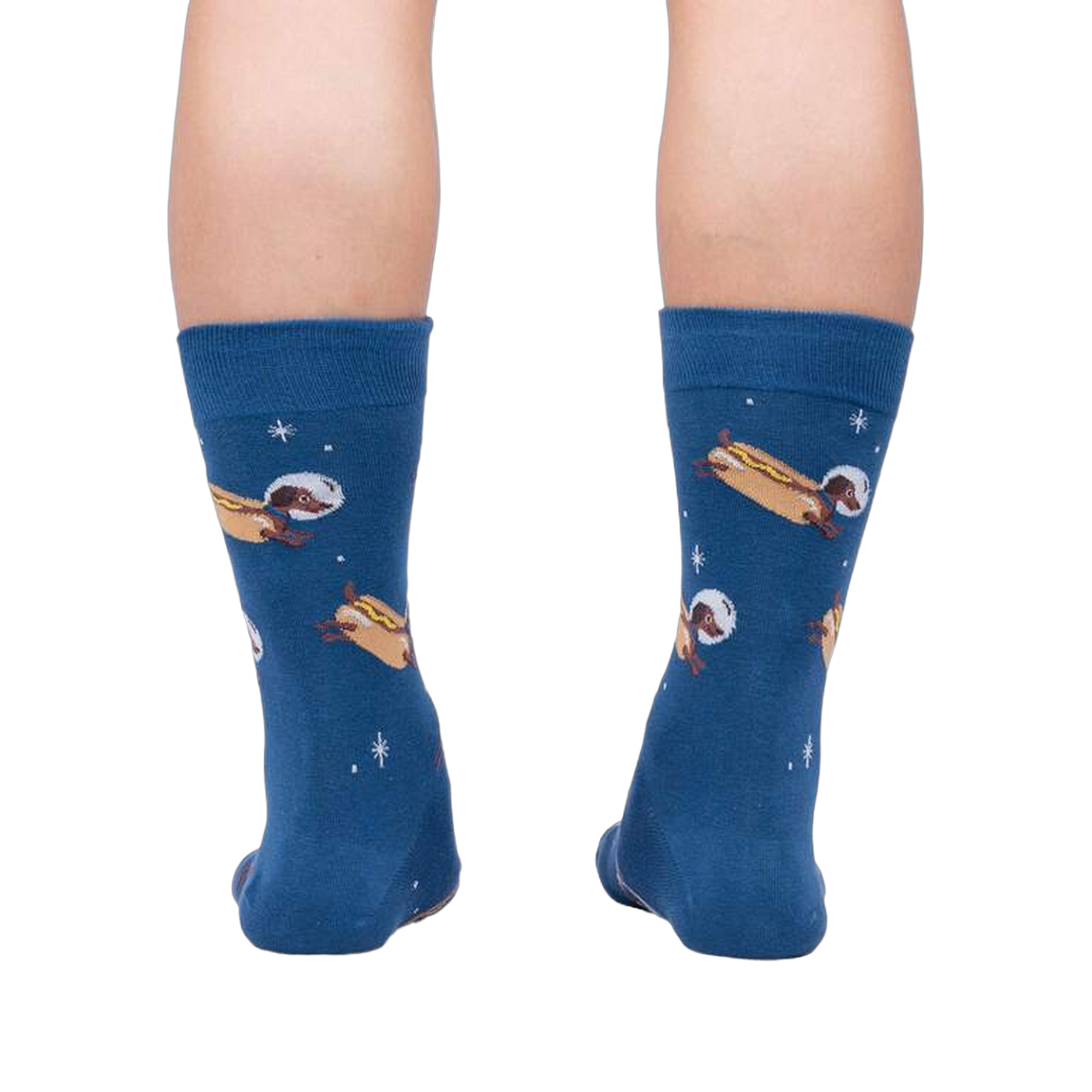Rear view of the 'Weiner Dogs, In Space!' socks on a person's legs.