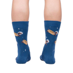 Rear view of the 'Weiner Dogs, In Space!' socks on a person's legs.